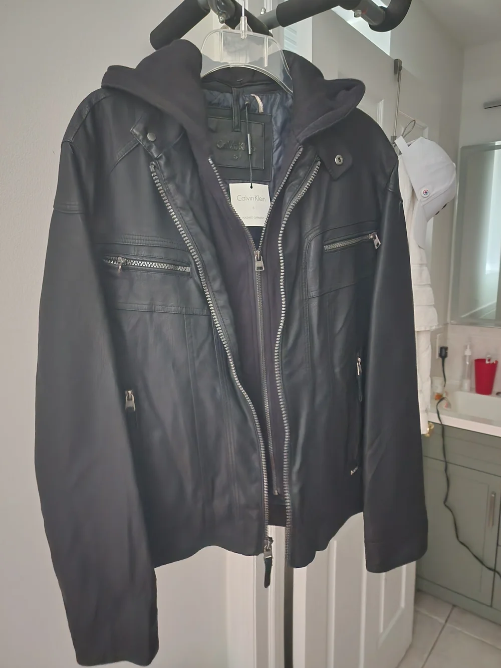 Calvin Klein Black Leather Hooded Bomber Jacket. Never Worn.
